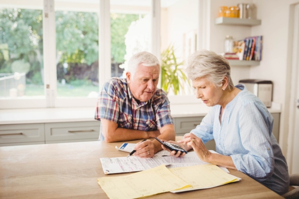 worried couple checking high energy bills