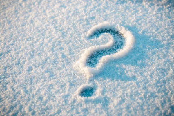 Question mark drawn on snow depicting FAQs about heating oil consumption