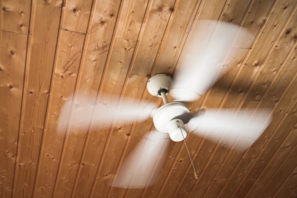 ceiling fan running to help keep house cool during summer