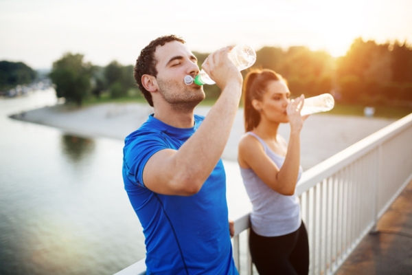couple wearing breathable clothes while staying hydrated