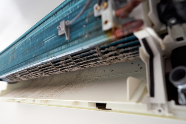 dust and dirt inside old air conditioner depicting bacteria growth that can cause infection