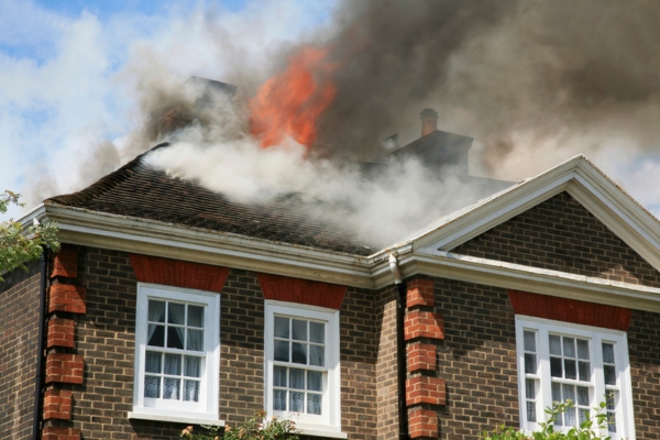 house fire on the roof depicting fire hazard of old AC