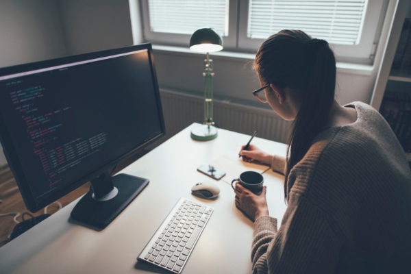 woman continuing work at home office during power interruption