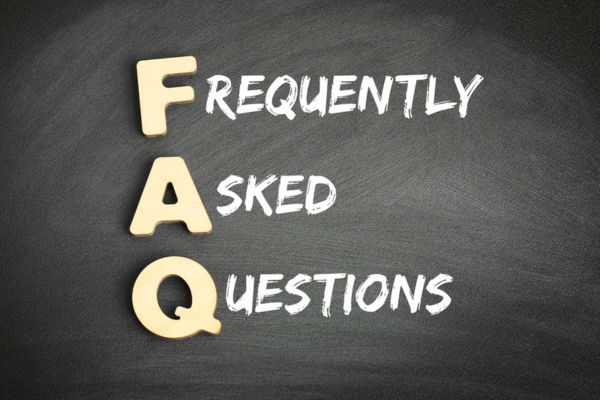 Frequently asked questions spelled using wooden letters and chalk