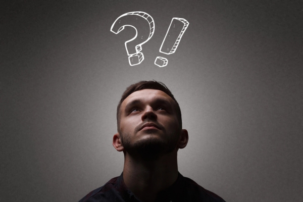 man looking up with question mark and exclamation point on top of head depicting how to stop flickering lights