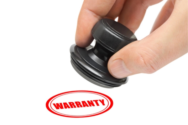 warranty rubber stamp and hand depicting HVAC warranty