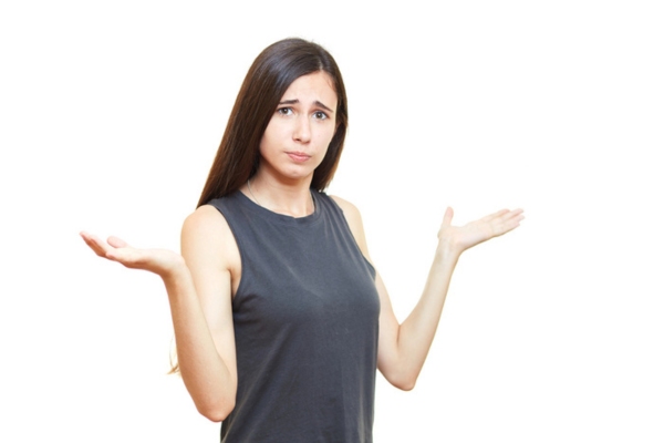 woman holding both hands up in the air depicting how to close air conditioner when summer ends