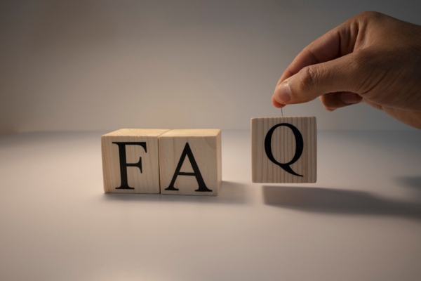 FAQ spelled using wooden letter blocks depicting oil storage tank sludge