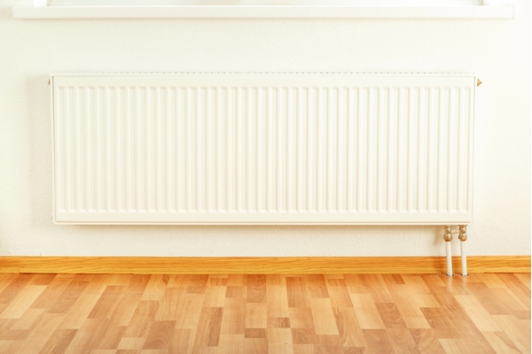 image of a hot water radiator installed against a wall