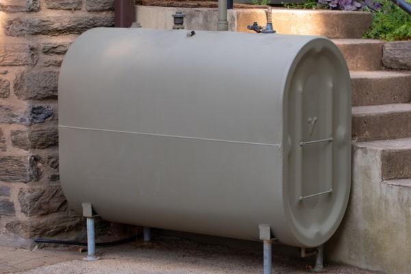 residential oil tank installed depicting sludge