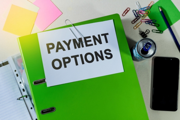 green office folder labeled payment options and oil delivery plans