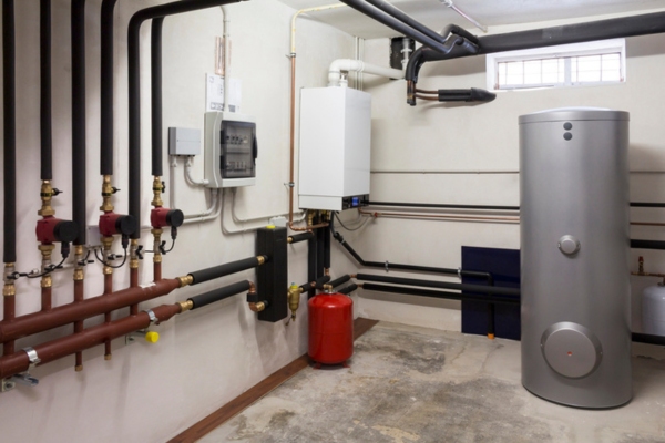 image of a boiler system and pipes in a boiler room